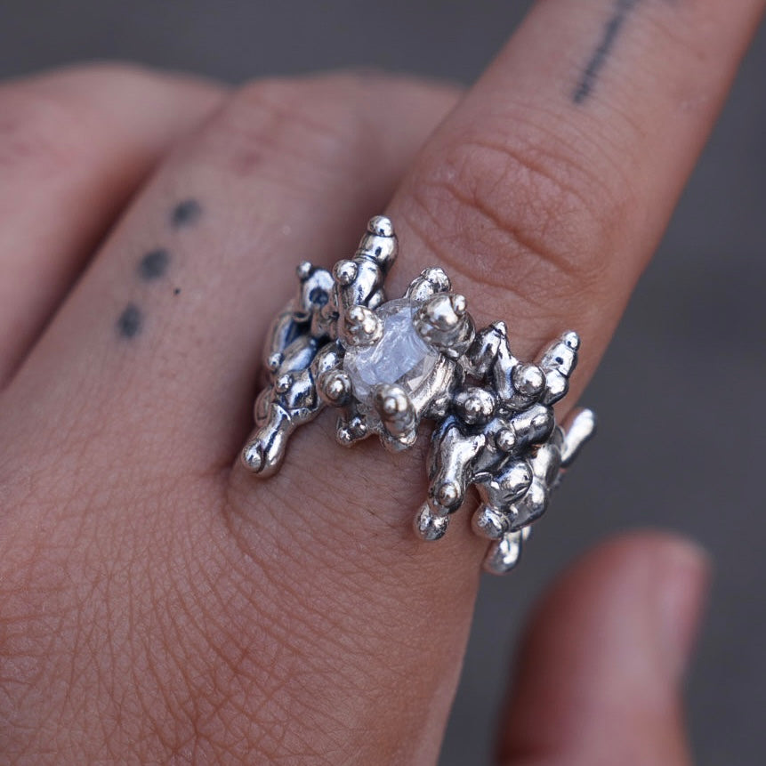 All over silver ring set with stone