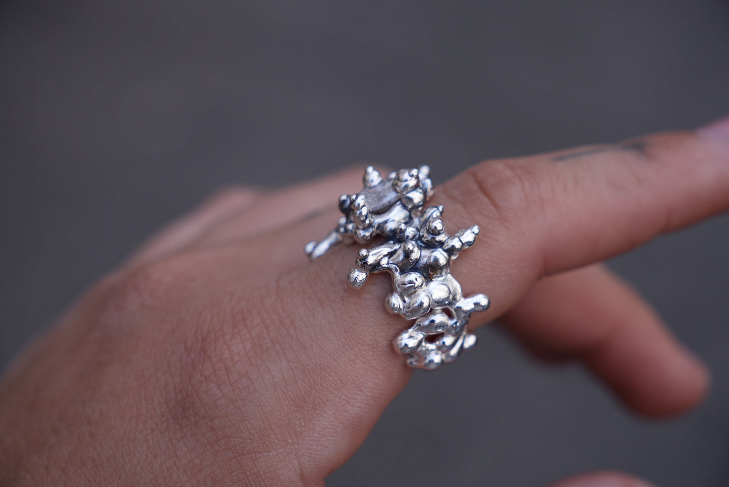 All over silver ring set with stone