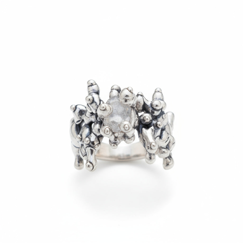 All over silver ring set with stone
