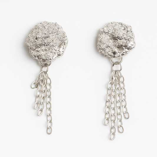 Silver druzy earrings with chain drops on a white background