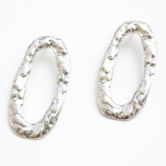 Pair of silver hoop earrings on a white background