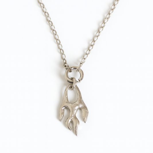 Silver necklace with a unique pendant on a white background