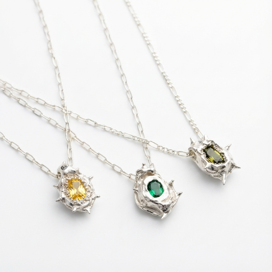 Spiky silver necklaces . Colorful stones. Hand made silver jewelry 